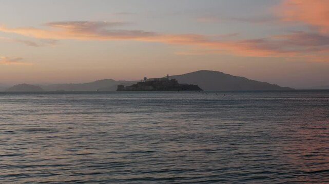Slow motion landscape of mountain of Alcatraz Island bay area San Francisco city afternoon sunset prison cell jail tourism travel California USA America museum block haunted attraction