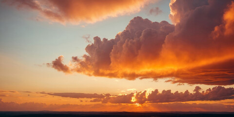 Fototapeta premium Beautiful Orange Sky with Clouds at Sunset Over a Mountain Landscape