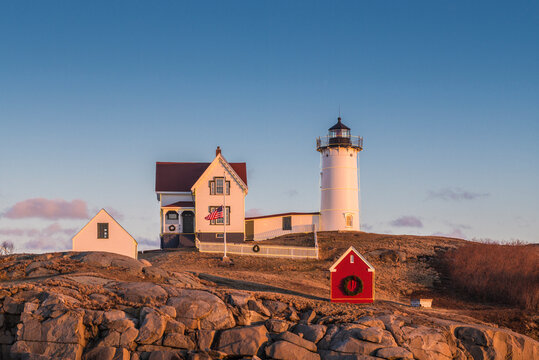 USA, Maine, York Beach. Nubble Light lighthouse at dusk