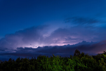 Thunderstorm, electrostatic discharge in the night sky, branching lightning high above the clouds....