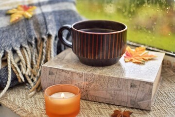 Warm cozy composition on the window. Autumn concept.