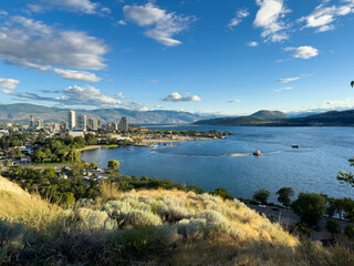 View from Knox Mountain of Kelowna cityscape with Okanagan Lake and a blue sky above