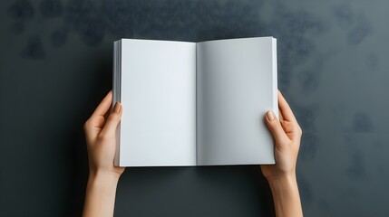 Naklejka premium Minimalist Mockup: Elegant Female Hands Holding a Blank Magazine on a Clean Gray Background, Perfect for Branding and Design Presentations.