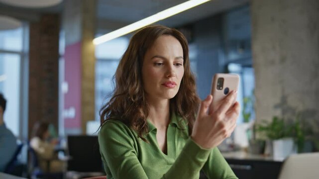 Worker hand receive message good news in office closeup. Happy manager success