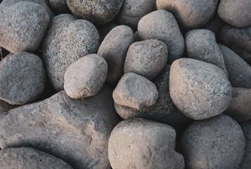 Many rounded pebbles at shore