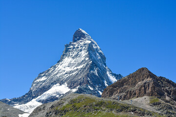 Stunning view of the magnificent Matterhorn mountain, Valais, Switzerland. Swiss Alps landscape in Summer. Space for copy. 


