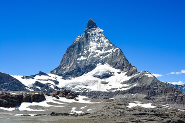 Stunning view of the magnificent Matterhorn mountain, Valais, Switzerland. Swiss Alps landscape in Summer. Space for copy. 

