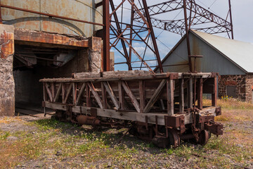 Ruins of An Old Rail Car Outside A Former Mine Building