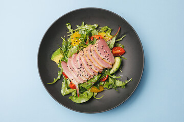 Appetizing salad with duck breast. Food photography, restaurant food presentation.