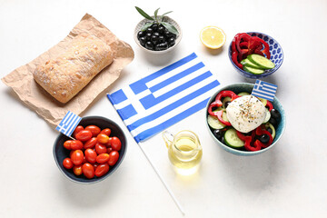 Composition with flag of Greece and different food on white table