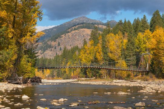 Tawlks-Foster Suspension Bridge and fall foliage along the Methow River near Mazama, Washington State.