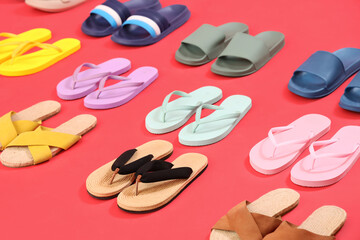 Many pairs of flip-flops on red background