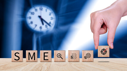 SME concept of business, SME abbreviation of Small and Medium Enterprises, Startup Idea Step of wooden cube blocks labeled SME.