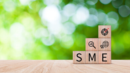 SME concept of business, SME abbreviation of Small and Medium Enterprises, Startup Idea Step of wooden cube blocks labeled SME.