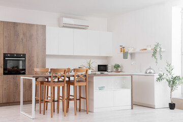 Dining table in interior of kitchen