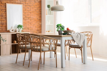 Interior of modern dining room with table and chairs