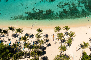 Top view of Tropical beach with palm trees and blue lagoon water. Pagudpud, Ilocos Norte Philippines
