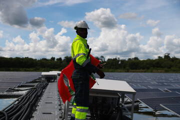 Floating Solar panel farm, black male energy engineer and construction inspecting, renewable energy and installation check with the contractor, eco-friendly and sustainable. Solar energy, sustainable 