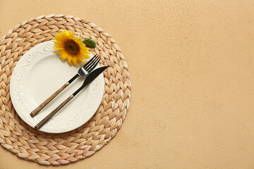 Beautiful table setting with sunflower on brown background