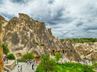 Tourists visiting goreme open air museum with its rock formations and cave churches