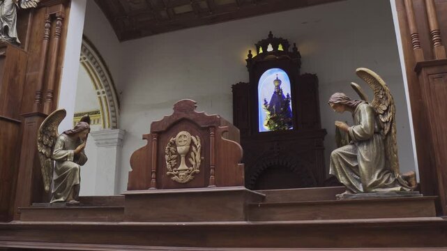 Church interior in Sri Lanka with statues and sculptures
