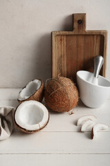 Fresh coconuts on white wooden table