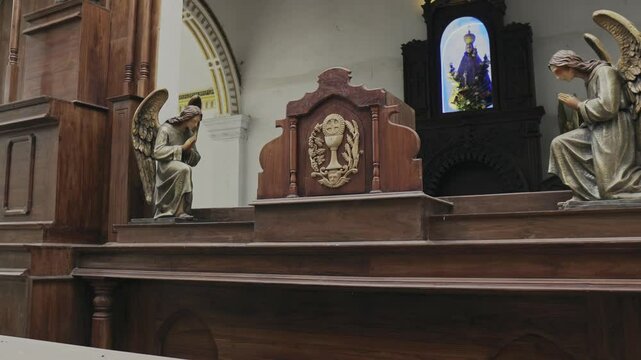 Church interior in Sri Lanka with statues and sculptures
