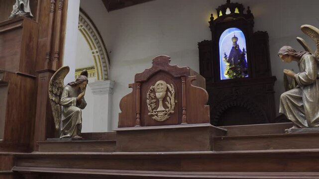 Church interior in Sri Lanka with statues and sculptures
