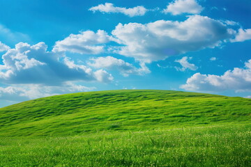 Fototapeta premium Smooth meadow on the hill with blue sky, beautiful landscape