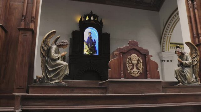 Church interior in Sri Lanka with statues and sculptures

