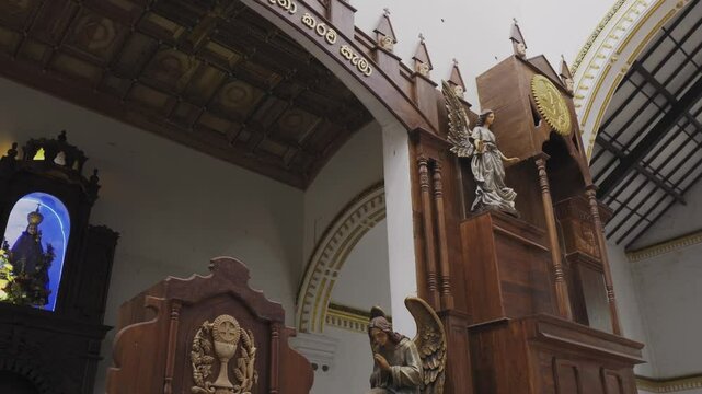 Church interior in Sri Lanka with statues and sculptures
