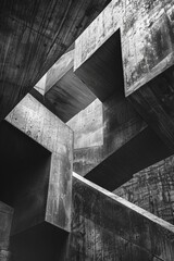 A black and white photo of a concrete structure with intricate details