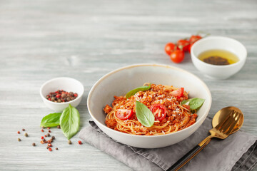 Pasta Spaghetti Bolognese in white plate on gray background. Bolognese sauce is classic italian cuisine dish. Popular italian food.