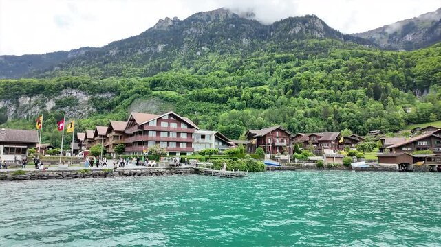 travel by cruising boat in briez lake is interest activity and people can visit very nice iseltwald village Interlaken Switzerland 