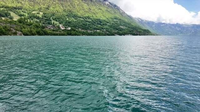 travel by cruising boat in briez lake is interest activity and people can visit very nice iseltwald village Interlaken Switzerland 