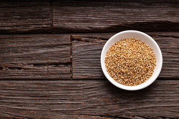Amaranthus - Bowl full of amaranth seed pops. wooden background