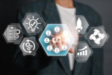 A businessman interacts with a virtual interface displaying crowdfunding icons, symbolizing financial growth, innovation, and collaborative investment.