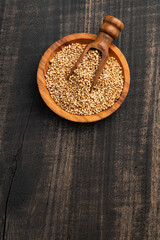 Amaranthus - Bowl and spoon filled with amaranth seed pops.