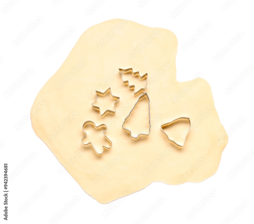 Wall mural Raw dough and cookie cutters isolated on white, top view