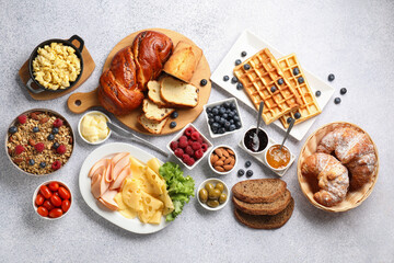 Tasty breakfast. Flat lay composition with many different food on grey textured table