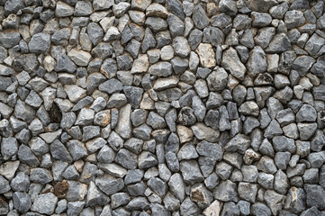 Granite stones wall , stacked stone texture background.
 