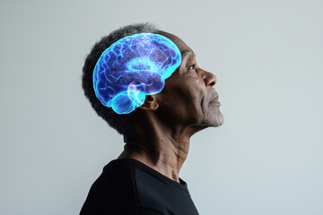Side view concept photo of an african american elder man with glowing brain on a white background