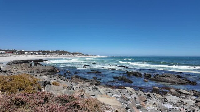 Yzerfontein Western Cape South Africa, 27.03.2024. Video. Clifftop view of the tidal waves and rocky beach area at Yzerfontein  on the west coast of South Africa.