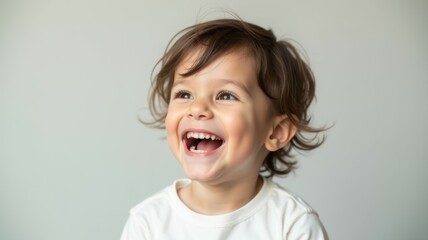 A young child with a big smile on his face