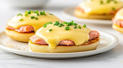 Eggs Benedict with Smoked Salmon and Hollandaise Sauce on English Muffin: A Perfect Brunch or Breakfast Dish Featuring Classic Flavors and Elegant Presentation