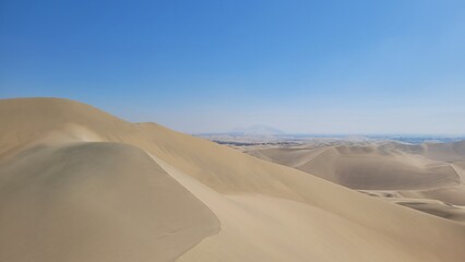 Sand dunes desert city Peru