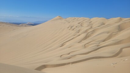 Sand dunes desert city Peru