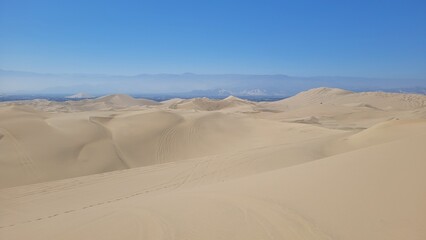 Sand dunes desert city Peru