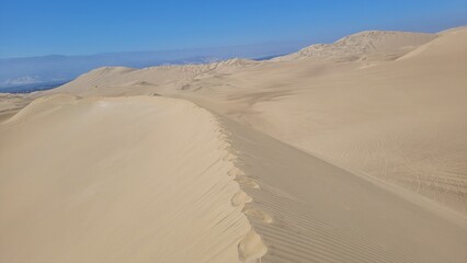 Sand dunes desert city Peru