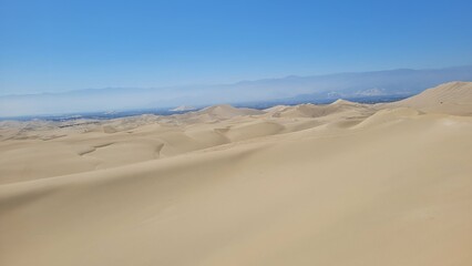 Sand dunes desert city Peru